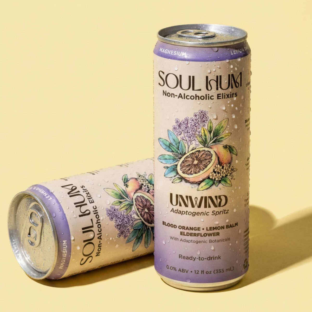 Unwind Adaptogenic Spritz botanical drink in a beige can with purple accents and citrus-floral artwork
