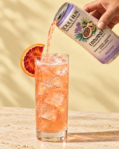 Pouring Unwind Adaptogenic Spritz over ice